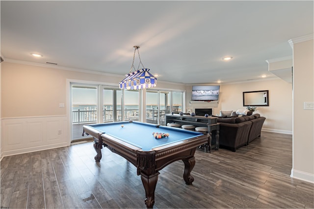 rec room featuring dark wood-style floors, visible vents, and crown molding