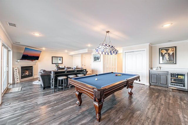 playroom with dark wood-style floors, wine cooler, visible vents, and ornamental molding