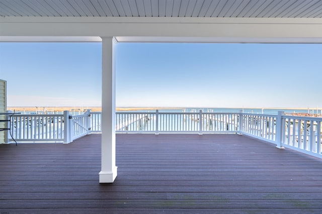 wooden terrace with a water view