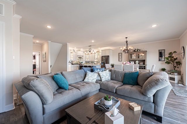 living area featuring recessed lighting, visible vents, dark wood-style floors, an inviting chandelier, and crown molding