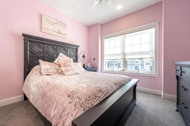 bedroom with carpet floors, baseboards, and a ceiling fan