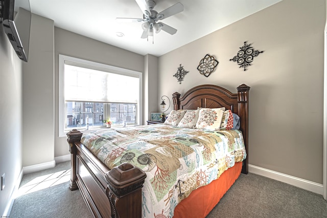 carpeted bedroom with ceiling fan and baseboards