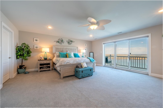 bedroom featuring visible vents, baseboards, light colored carpet, ceiling fan, and access to exterior