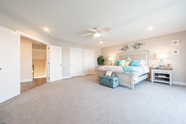 bedroom with multiple closets, recessed lighting, a ceiling fan, carpet flooring, and baseboards