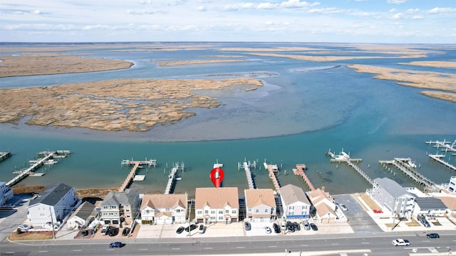 bird's eye view featuring a residential view and a water view