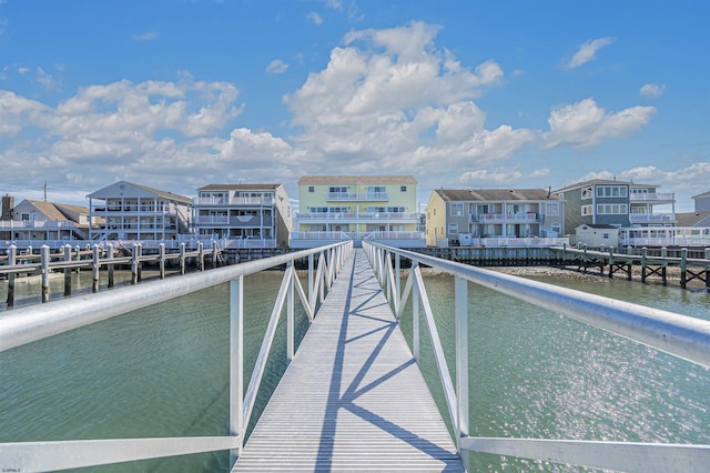 exterior space featuring a water view and a residential view