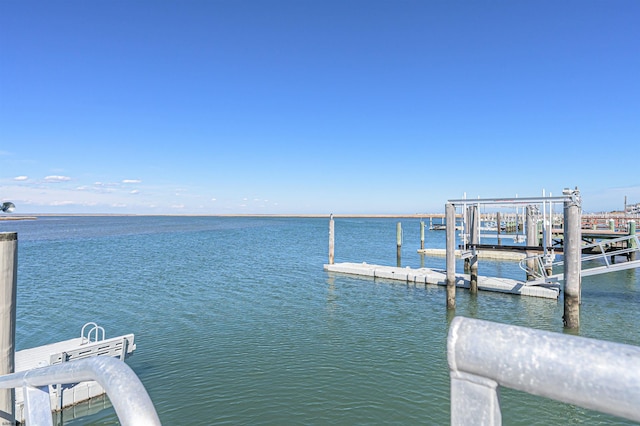 view of dock featuring a water view and boat lift