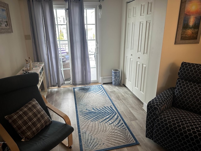 sitting room with light wood-style floors