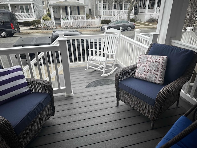 wooden deck featuring a residential view