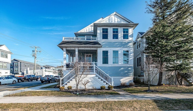 view of front of house with a porch and stairs