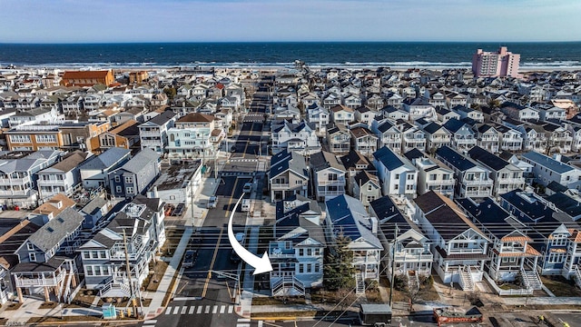 birds eye view of property featuring a residential view and a water view