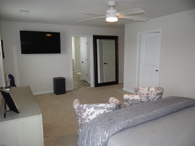 bedroom with baseboards, ceiling fan, and light colored carpet