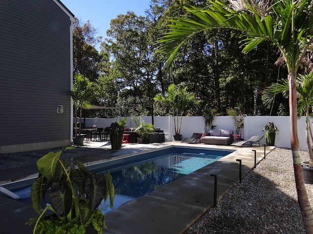 view of pool with a patio area, a fenced backyard, outdoor lounge area, and a fenced in pool