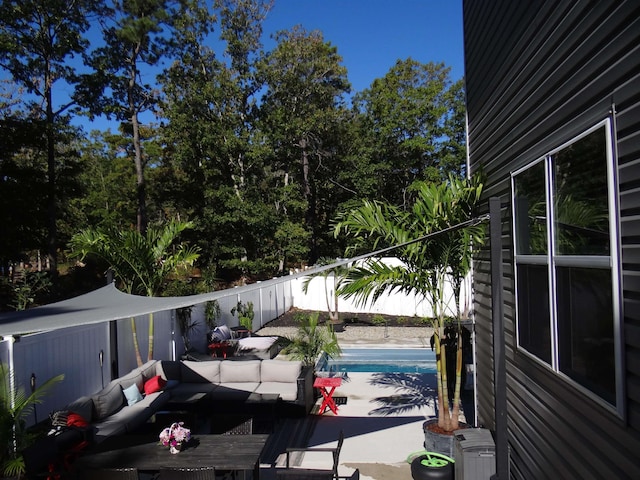 view of vehicle parking with a fenced backyard and a fenced in pool