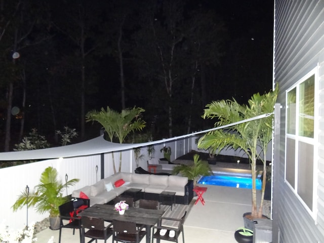 balcony featuring outdoor dining space and a patio