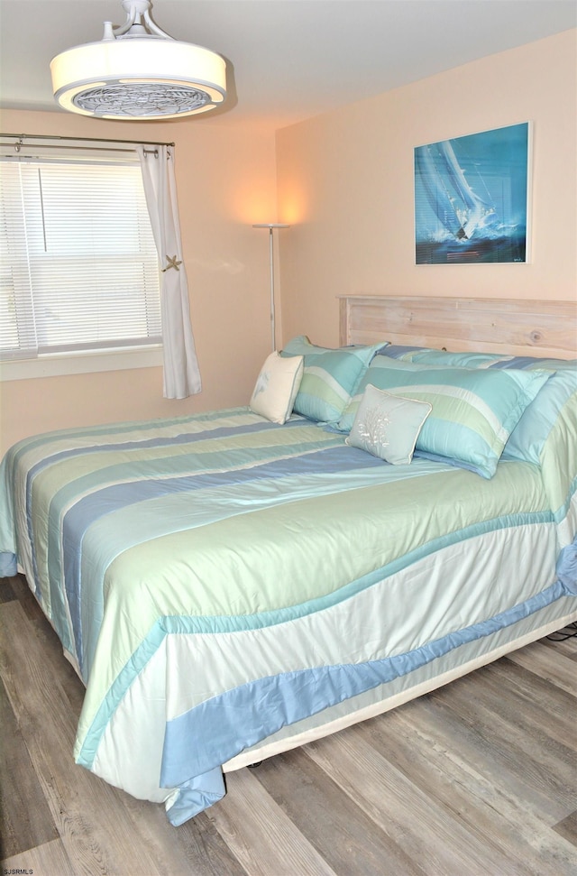 bedroom with wood finished floors