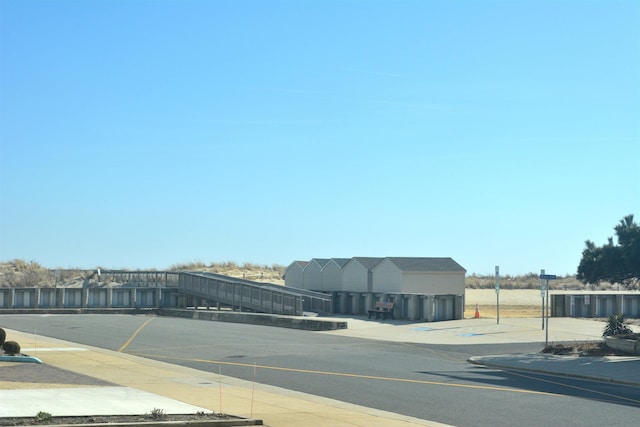 view of road with curbs and sidewalks