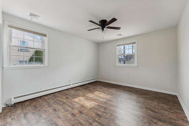 unfurnished room featuring ceiling fan, a baseboard radiator, wood finished floors, visible vents, and baseboards