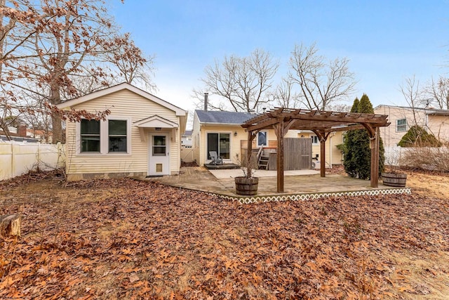 back of property featuring a patio, fence, and a pergola