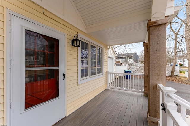 wooden terrace featuring covered porch