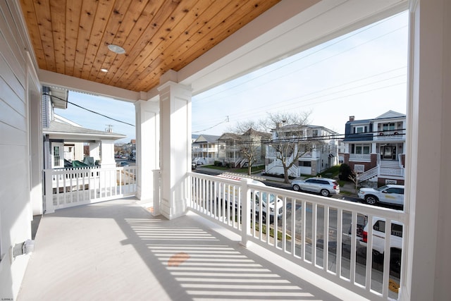 balcony with a residential view and a porch