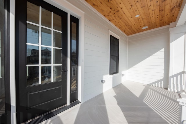 view of exterior entry with covered porch