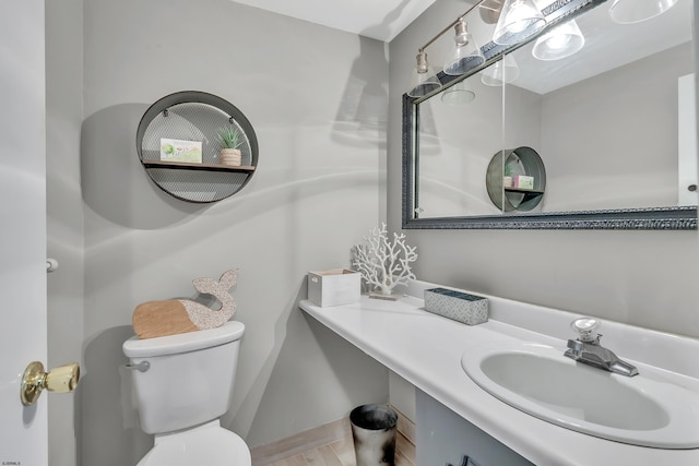 half bath with vanity and toilet