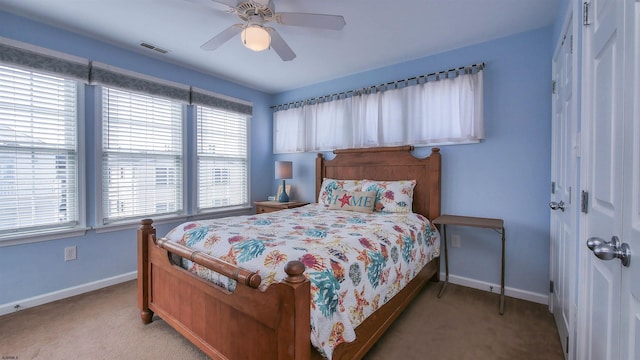 bedroom featuring visible vents, ceiling fan, light colored carpet, and baseboards