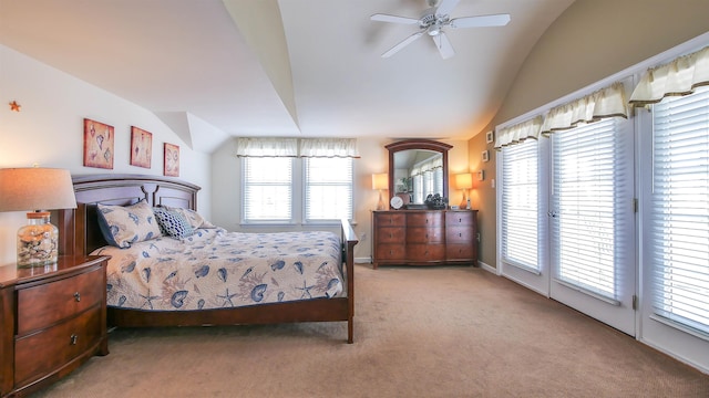 carpeted bedroom featuring lofted ceiling, access to outside, and baseboards