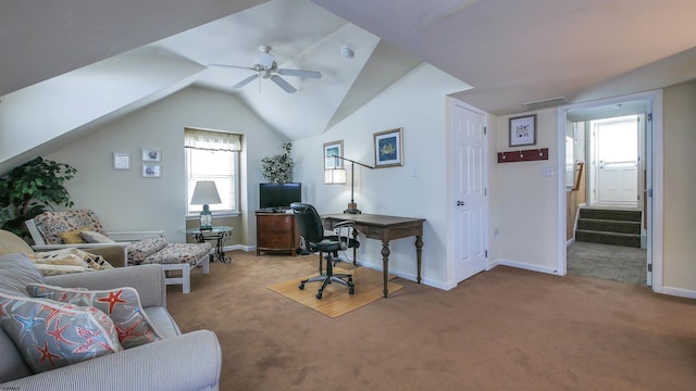 carpeted home office with ceiling fan, visible vents, baseboards, and vaulted ceiling