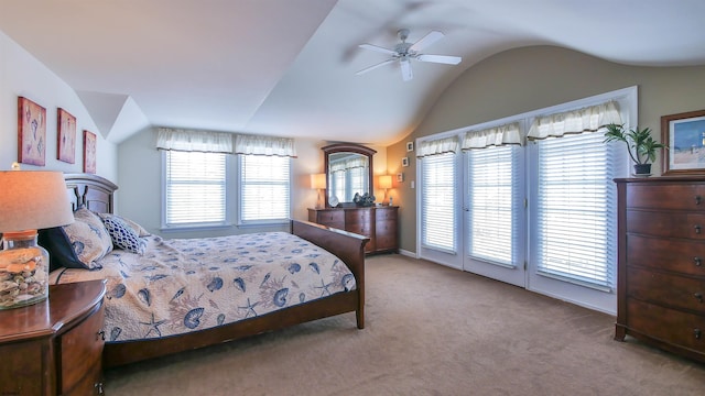 carpeted bedroom featuring lofted ceiling, access to outside, and multiple windows