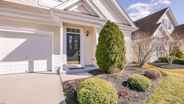 property entrance featuring an attached garage