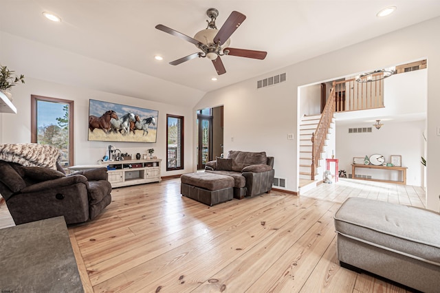 living room featuring light wood-style floors, stairs, visible vents, and recessed lighting