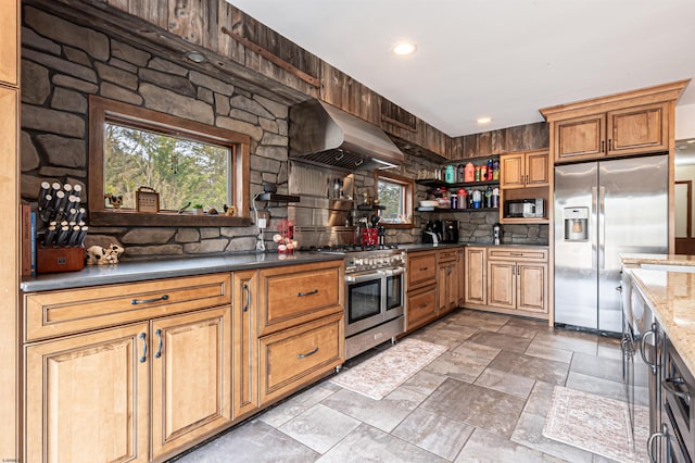 kitchen featuring tasteful backsplash, appliances with stainless steel finishes, stone finish flooring, extractor fan, and open shelves