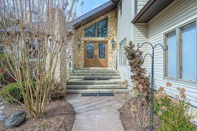 entrance to property with stone siding and french doors