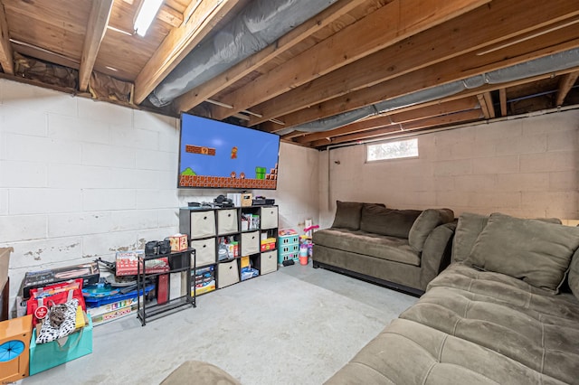 living area featuring concrete floors