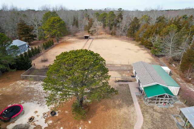 drone / aerial view featuring a wooded view