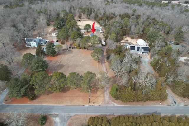 aerial view featuring a wooded view