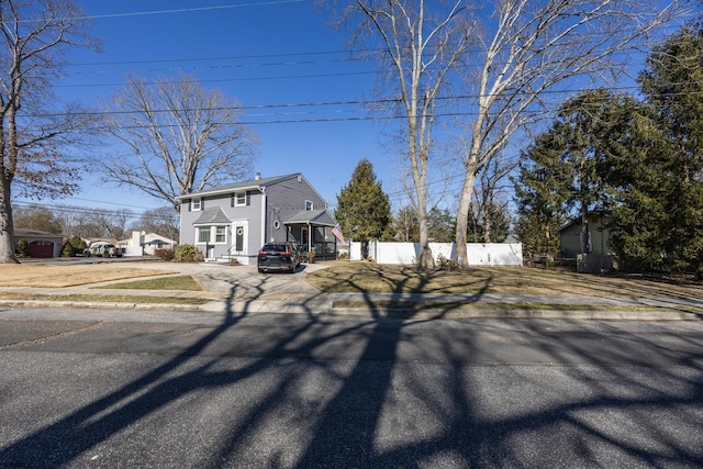 view of front of property featuring fence