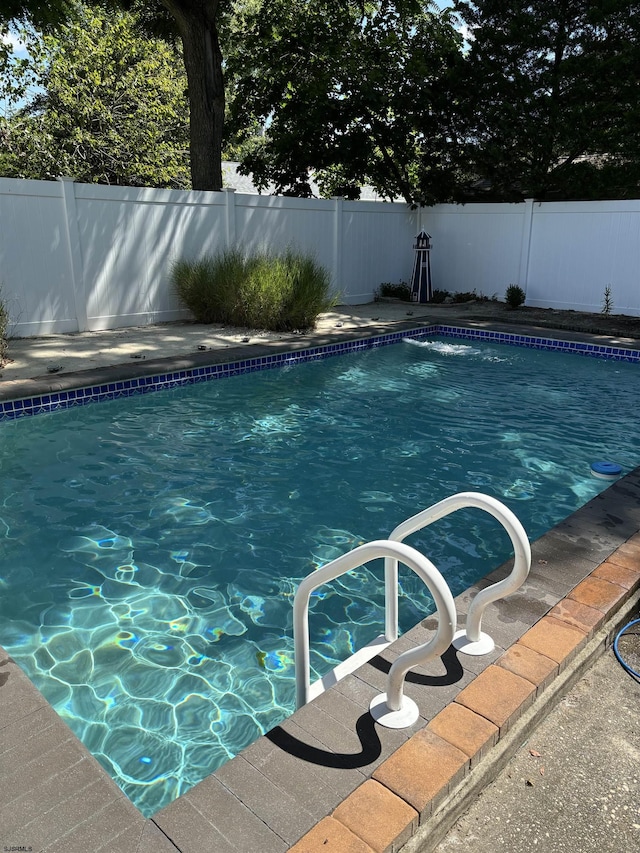 view of pool featuring a fenced in pool and a fenced backyard