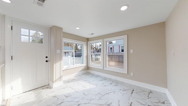 foyer featuring marble finish floor, recessed lighting, visible vents, and baseboards