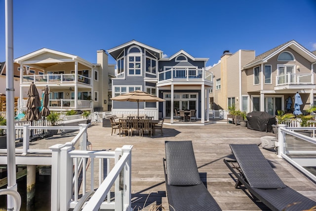 rear view of house with outdoor dining space