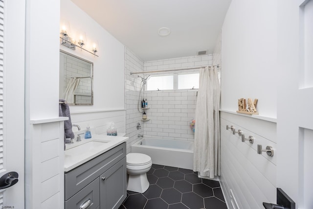 full bath with shower / tub combo with curtain, visible vents, toilet, vanity, and tile patterned flooring