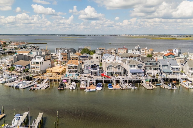 water view featuring a residential view and a dock