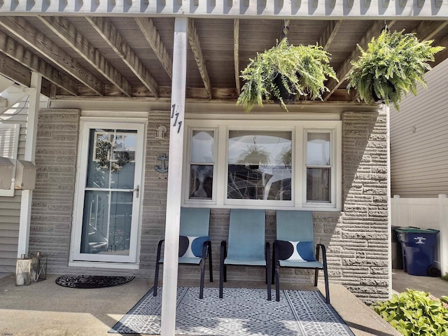 property entrance with stone siding