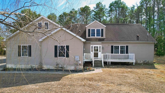 view of front facade featuring a shingled roof