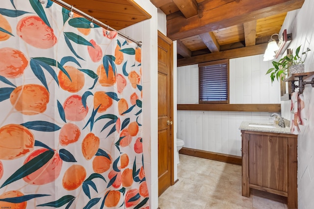 full bathroom featuring toilet, a shower with shower curtain, wood ceiling, vanity, and beam ceiling