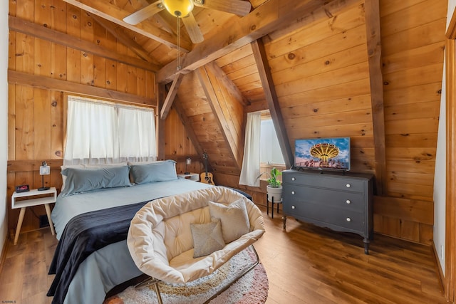 bedroom featuring vaulted ceiling with beams, wood walls, wood ceiling, and multiple windows