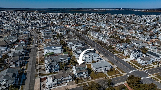 birds eye view of property with a residential view