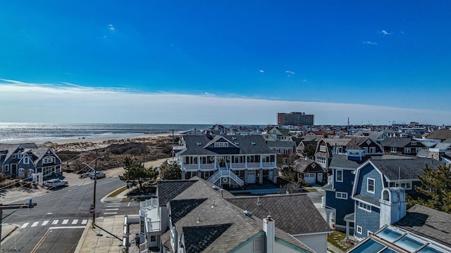 bird's eye view featuring a beach view and a water view